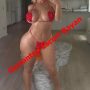Woman in a red bikini posing in a modern living room, with bold red text 'Gaziantep Escort Bayan' across the image.